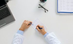 doctor hands with prescription at clinic