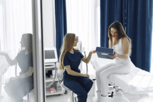 Woman with a doctor in cosmetology studio