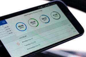 Electronic logging device for trucking industry with hours of service displayed on smarthphone screen