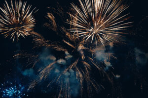 Colorful fireworks of various colors over night sky .