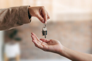 Young woman received house keys from real estate agent, new house, accommodation tenancy rental service concept