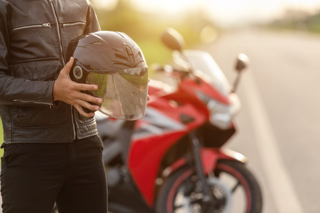 Motorcycle helmet on a table representing helmet laws and accident claims